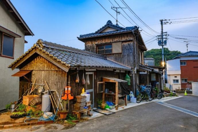 A historically preserved residence in Shodoshima. I purchased this image from https://www.dreamstime.com/kagawa-japan-july-historical-local-wooden-house-shodoshima-island-wooden-historical-residential-house-shodoshima-island-kagawa-image158706125 I’d like to fancy it up with words like “small fisherman’s market” or something to make it precious. 