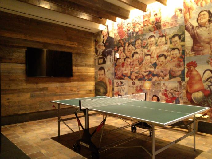 What better way to relax than by playing a little table tennis with a backdrop of reclaimed wood and Mexican-inspired artwork?