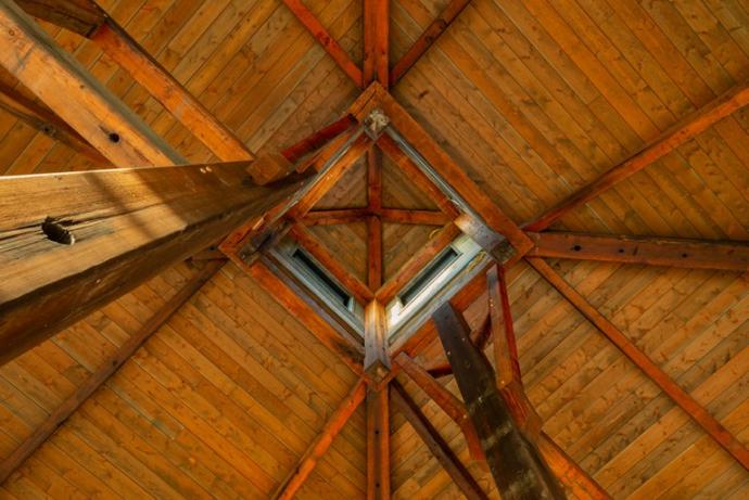 Along with most of the Douglas fir timbers, the original cupola was preserved and re-used inside the Point of the Bluff pavilion. Photo (C) Don Cochran Photography