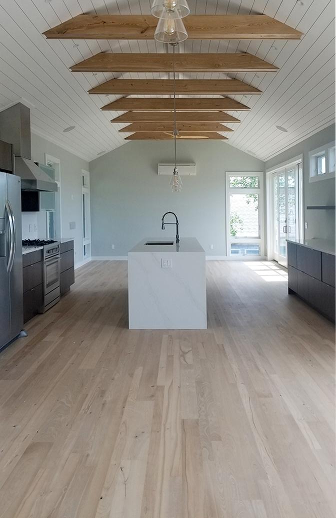Pioneer Millworks reclaimed American Gothic Ash Flooring with a white finish