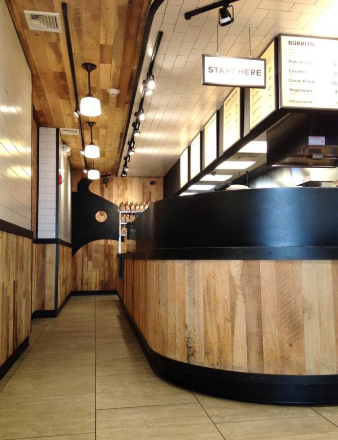 Settlers’ Plank Reclaimed Mixed Hardwoods found new life as wall and ceiling paneling in Dos Toros in NYC.