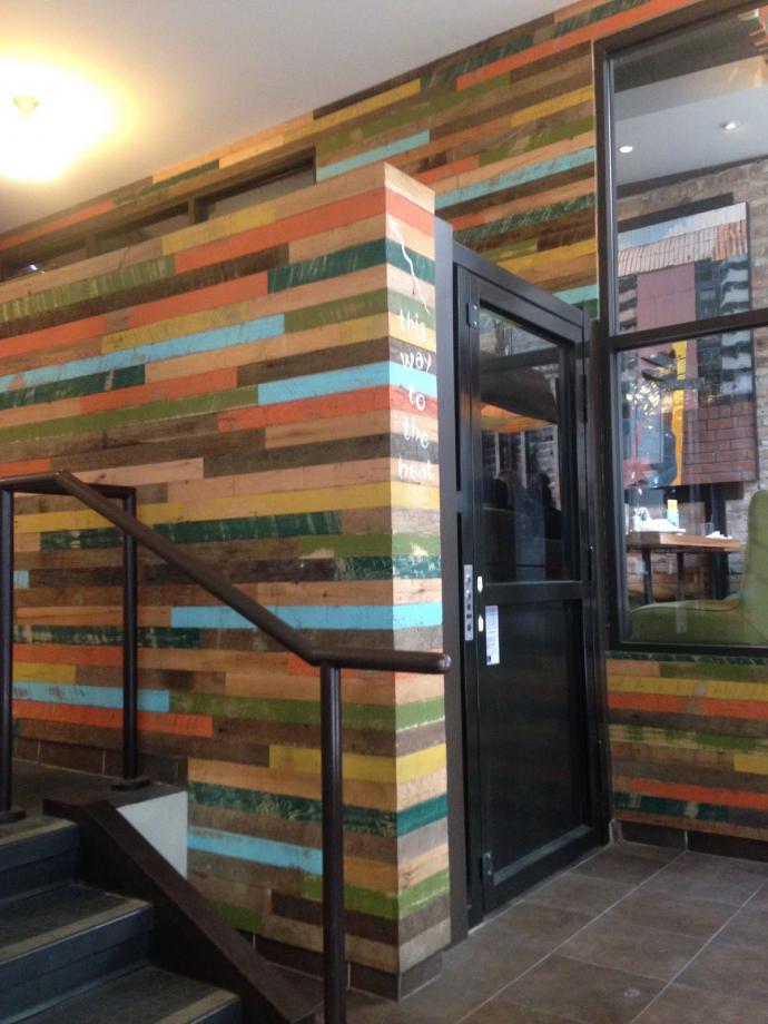 A little paint on our reclaimed wood unifies it with other bright colors throughout the restaurant