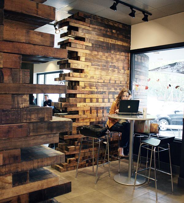 This exotic Indonesian hardwood blend is a perfect example of what can be created with the rough, as-found faces of recycled wood. Here spaces are divided and texture is created by these walls of a popular coffee shop.