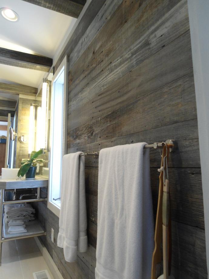 Reclaimed Barn Siding naturally has variations in thickness due to the irregular weathering of the boards on the barn. The contractors here carefully planed the back of each piece to lessen this effect and create a more uniform surface on the walls.