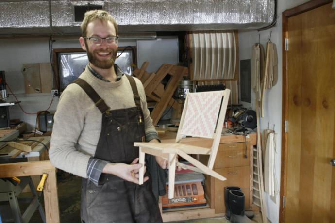 Bill holds the prototype for the chair he is making for Design Week Portland.