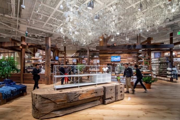 The MUJI store in Portland, OR created a display that utilizes an end of an original timber complete with hard-earned patina, texture, and bolt holes.