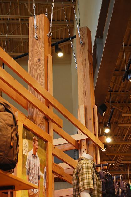 Industrial reclaimed timbers from the Mersman Table Factory were re-sawn then repurposed in a large retail store as supports for their center display area.