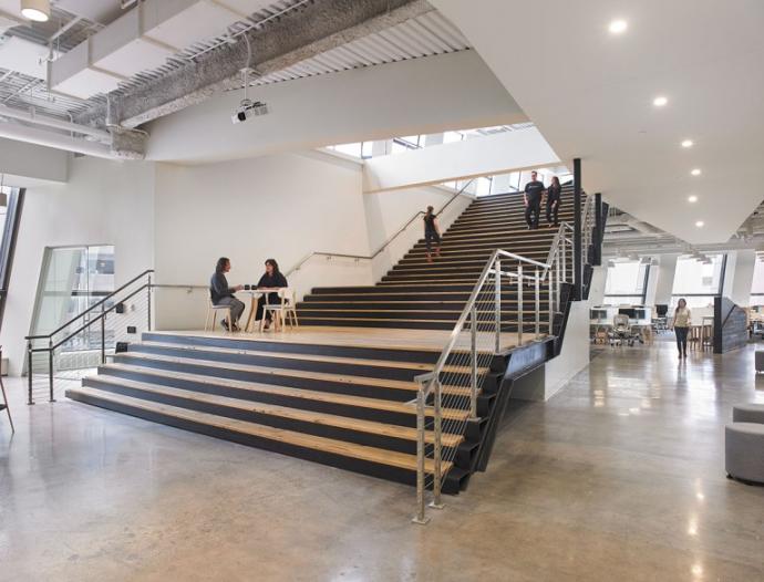 Pioneer Millworks American Gothic White Oak used throughout the large staircase in the agency’s space. Photo by Tim Wilkes.