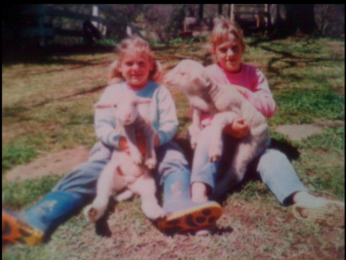 Photo here is of my sister and I with potty lambs on the property. You can just see on of the ladder stairs in the background of one cubby house.