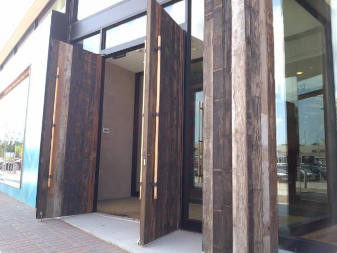 Anthropologie entrance with wine vat stock siding.