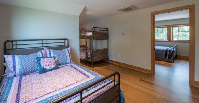 Once inside the bedrooms, the flooring transitions from wide to narrow, reminiscent of old narrow oak plank floors common to bygone cottages.