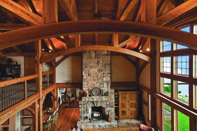 A potential for the future life of this Antique Heart Pine: timber frame projects, such as this family home on Cayuga Lake in New York crafted by New Energy Works.
