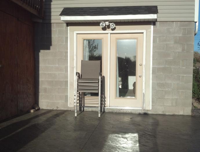 he concrete block wall didn’t do enough to complement the beautiful custom textured concrete patio.