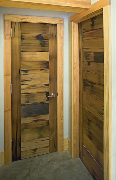 NEWwoodworks crafted interior doors for The Vermont Street Project timber frame home using the reclaimed pickle vat wood.