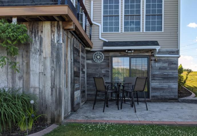 American Prairie weathered wood put back into use as exterior siding for a NY family’s favorite outdoor space.