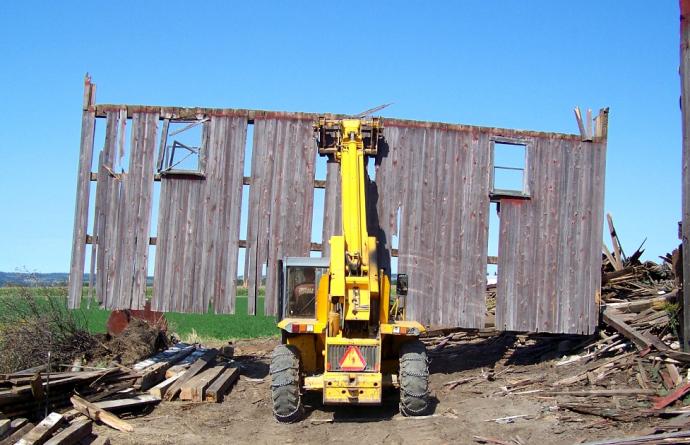 Acquisition crews carefully dismantle agricultural  buildings that have outlived their use. 