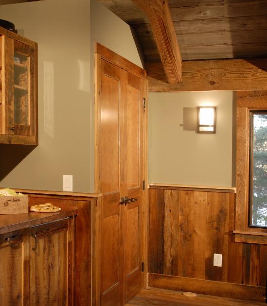 Settlers’ Plank reclaimed paneling was fitted to a timber frame home game room.