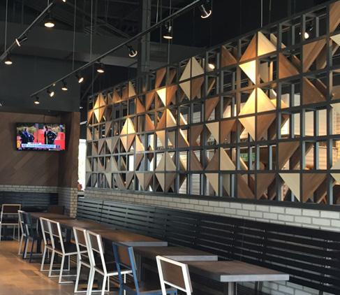 Sandra’s favorite Pioneer Millworks product, Modern Farmhouse Clean White Oak with custom ‘wedding white’ finish, adorns the divider wall of a Fort Lauderdale eatery. Photo from InsideFortLauderdale.com