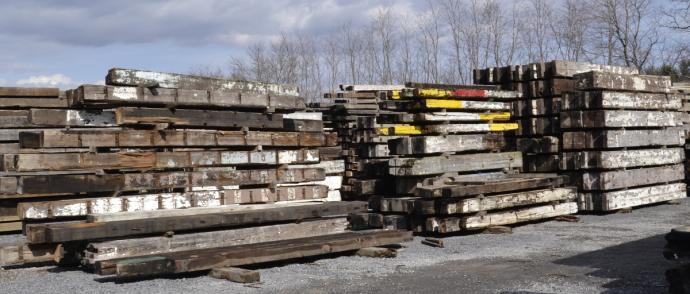 Industrial salvaged timbers at times include remnants of paint, markers of the timbers past life.