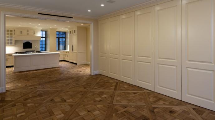 Each reclaimed oak piece was hand fitted to this Versailles pattern for a NYC apartment.
