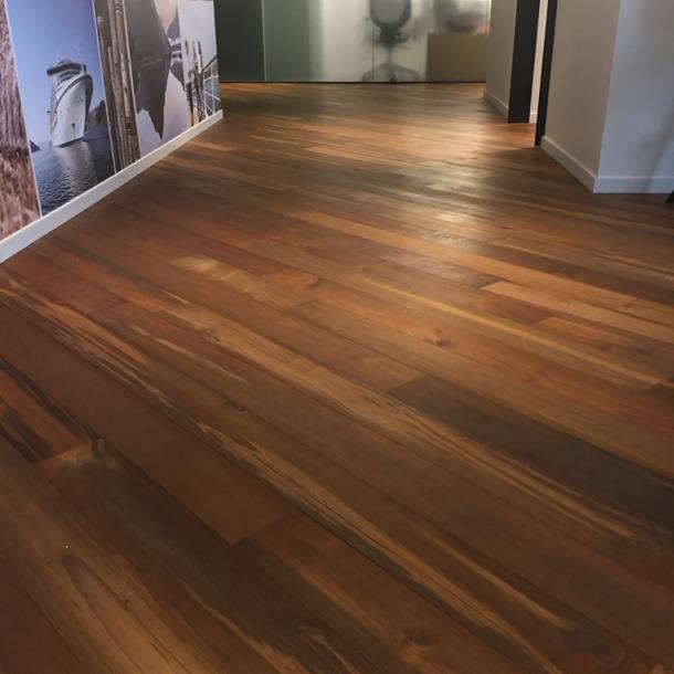 Reclaimed Teak Bright wood flooring flows throughout this cruise line's office space in Seattle, WA. 