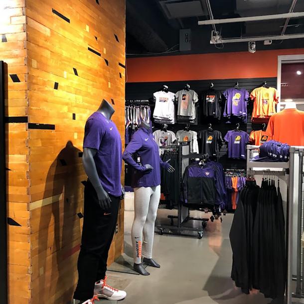 Original gym flooring is used as paneling on the pillars of the Phoenix Suns team store in Arizona.
