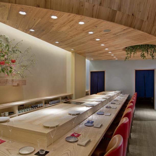 This sushi bar in New York City has American Gothic Elm ceilings and American Gothic White Oak reclaimed wood floors with a custom grey finish. Photo by Connie Zhou.