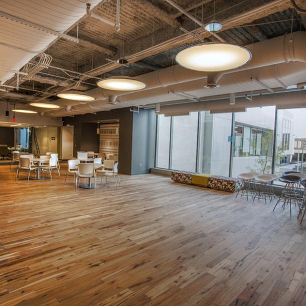 Pioneer Millworks American Gothic Hickory reclaimed wood flooring in an office space in Rochester, NY