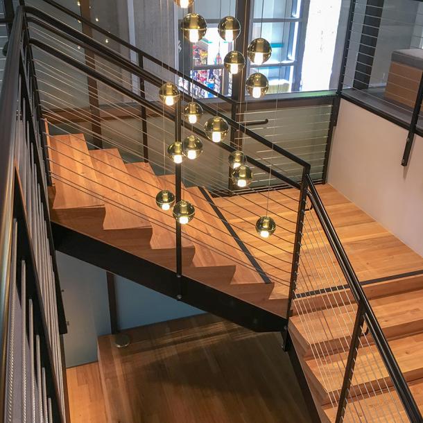 Pioneer Millworks reclaimed American Gothic Ash with poly and fire retardant used on stairs in San Fransisco, CA