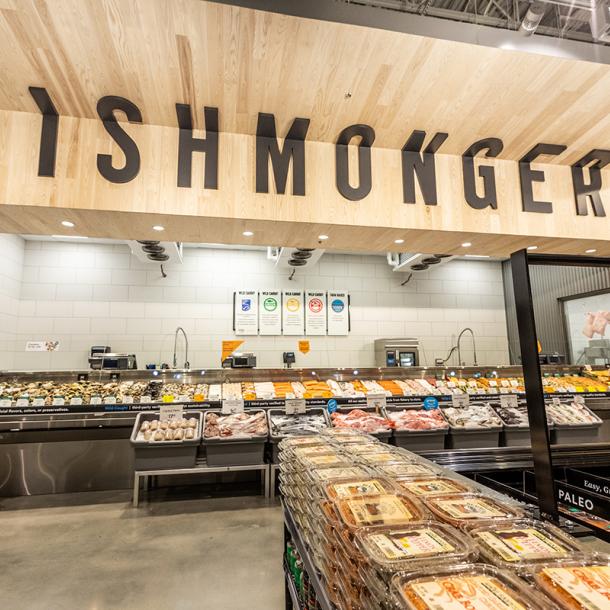 Pioneer Millworks Whole Modern Farmhouse Clean Ash paneling with poly and fire retardant in Whole Foods, Atlanta, GA