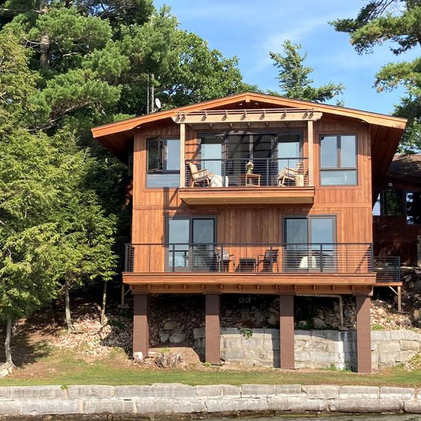 Private Residence on Alexandria Bay with Select Larch Exterior Siding wire brushed with a Light Brown non-VOC water-based penetrating sealer.