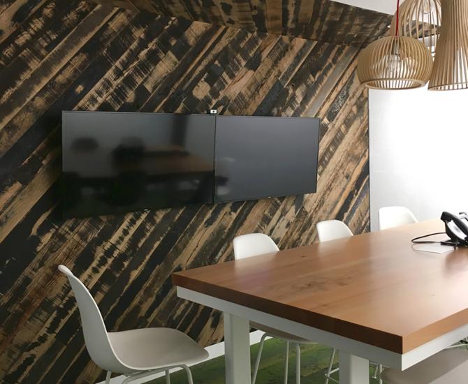Reclaimed Oak Black and Tan 50/50 wall paneling in meeting room