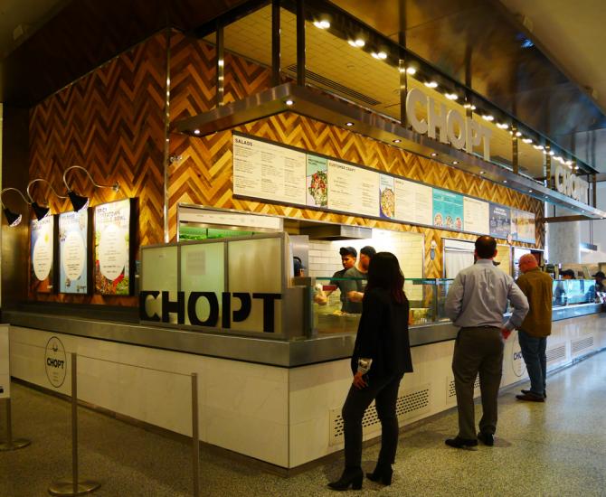Mixed Hardwoods Settlers' Plank around the ordering area of CHOP'T in New York City