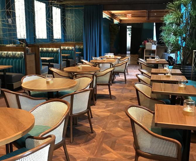 Intricate Versailles pattern panels made of Indonesian Teak featured in the Polynesian restaurant in this NYC Hotel.