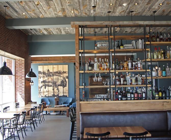 Reclaimed softwoods t&g ceiling joins other reclaimed wood tables, fixtures, cabinetry, doors, and more in Kindred Fare.