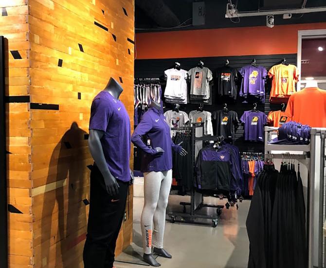 Original gym flooring is used as paneling on the pillars of the Phoenix Suns team store in Arizona.