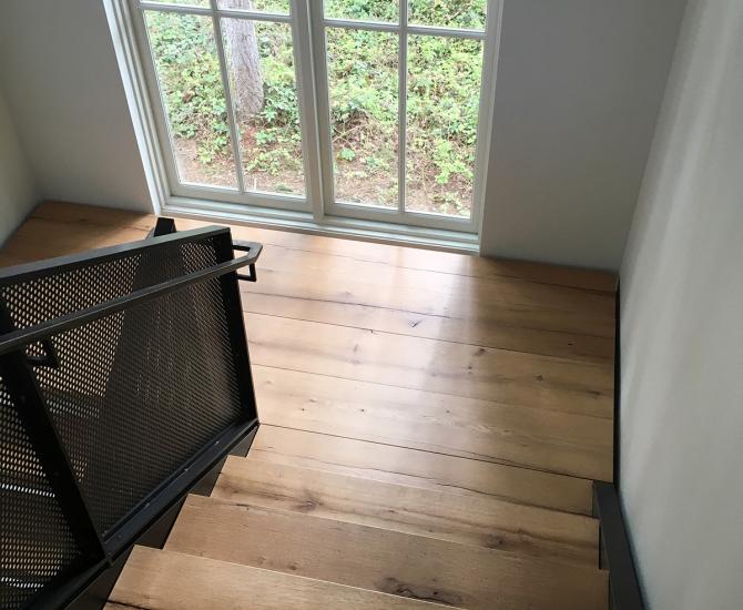 These stair treads were custom fabricated from American Gothic White Oak reclaimed wood