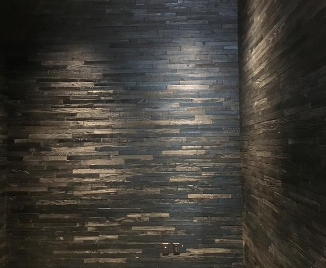 American Prairie Redwood reclaimed wood paneling with a custom black finish