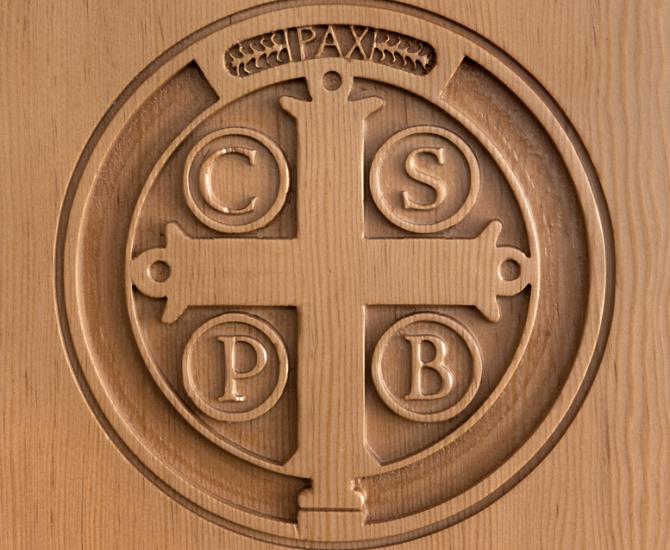 Douglas fir pedestals adorned with a laser engraved seal of the Mount Angel Abbey.