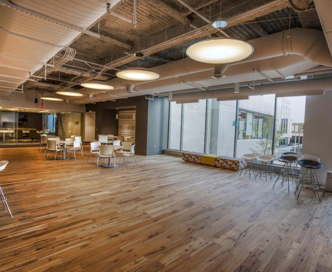 Pioneer Millworks American Gothic Hickory reclaimed wood flooring in an office space in Rochester, NY