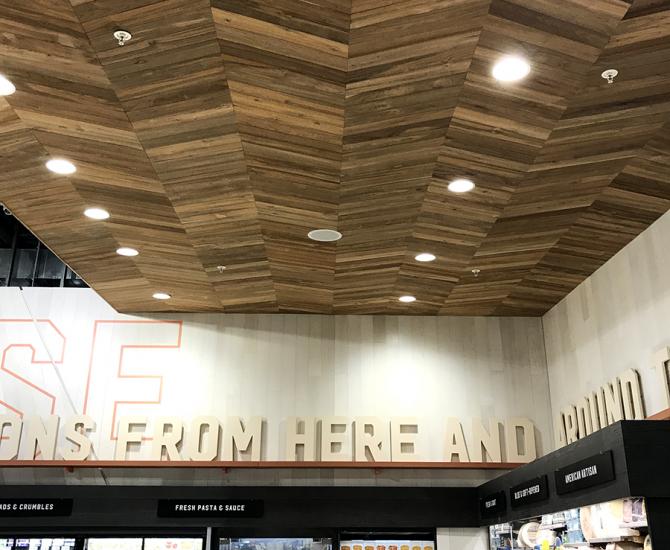 Bright Indonesian Teak is used for the chevron patterned ceiling. All wood is finished with a penetrating fire retardant.