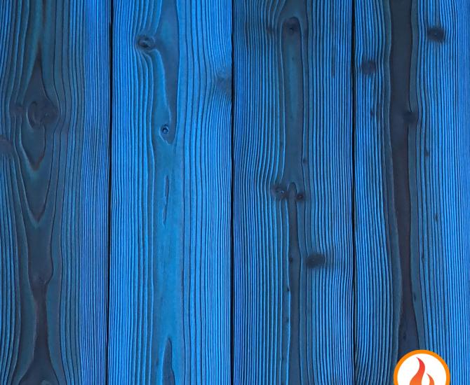 Shou Sugi Ban Larch Cobalt by Pioneer Millworks. Charred wood siding and paneling that is burned, brushed twice, and coated with an exterior oil 