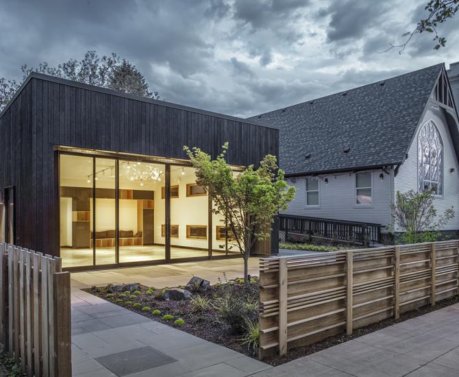 Shou Sugi Ban Larch Carbon by Pioneer Millworks. Black wood siding that is burned. Here seen as Exterior Siding at the Portland Playhouse in Portland, OR