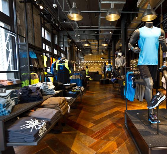 sPioneer Millworks reclaimed wood--Sports Collection--Bleacher Boards--Reclaimed Beacher Board floor in a herringbone pattern