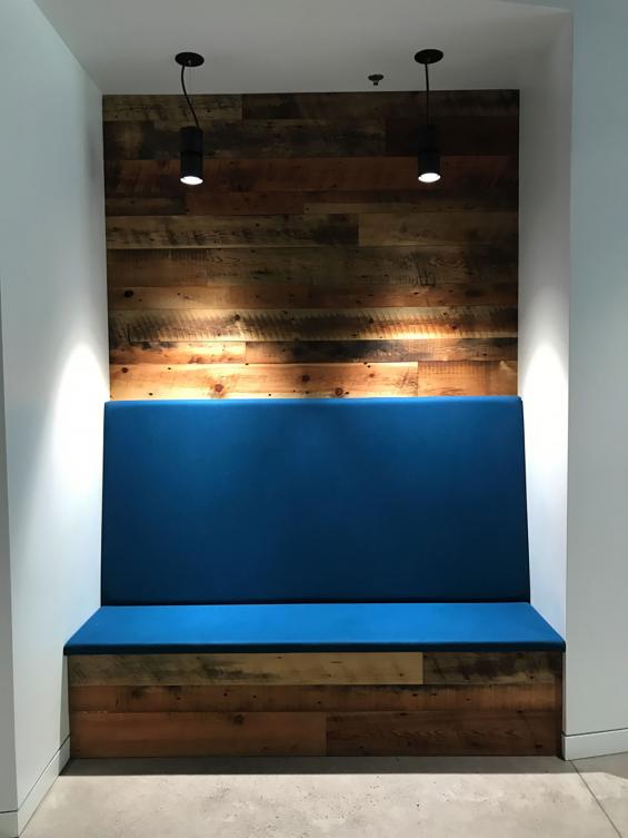Mixed Softwoods Grandma's Attic reclaimed wood wall paneling  around a seating area in the office