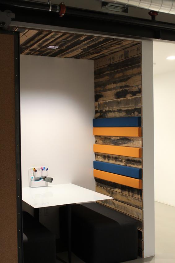 Reclaimed Oak Black and Tan 50/50 wall paneling in a seating area