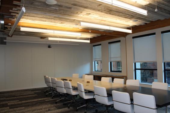 Mixed Softwoods Grandma's Attic reclaimed wood used as ceiling accents in this office conference room