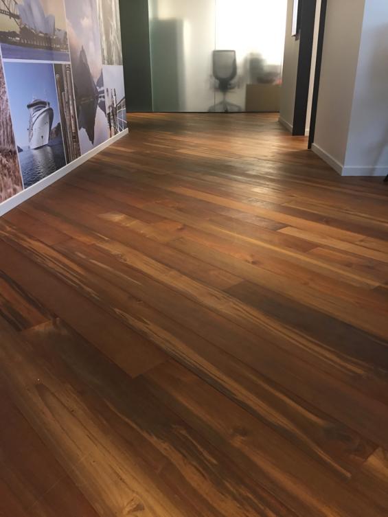 Reclaimed Teak Bright wood flooring flows throughout this cruise line's office space in Seattle, WA. 