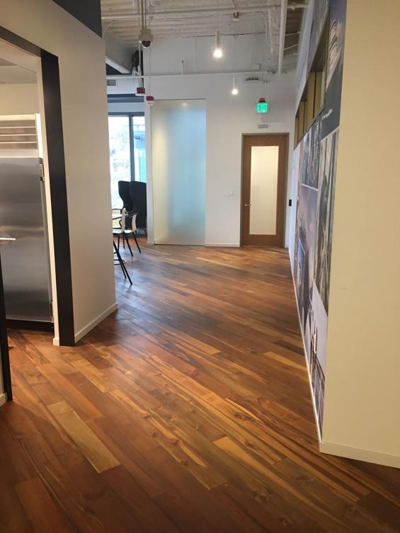 Reclaimed Teak Bright wood flooring flows throughout this cruise line's office space in Seattle, WA. 