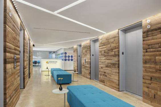 This office entryway is clad in reclaimed Mixed Oak Railyard Patina paneling. 